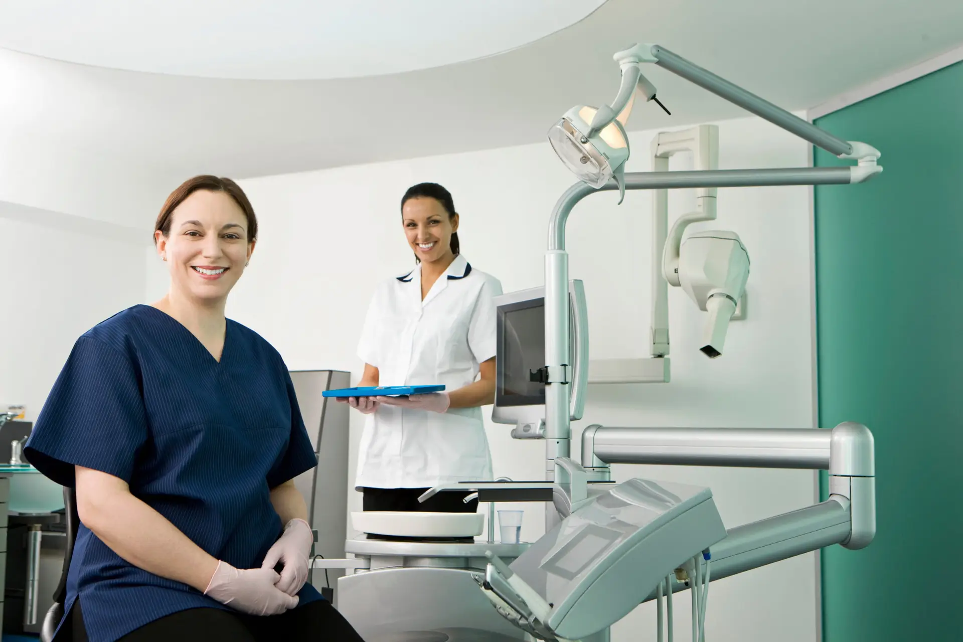 Female dentist with dental nurse